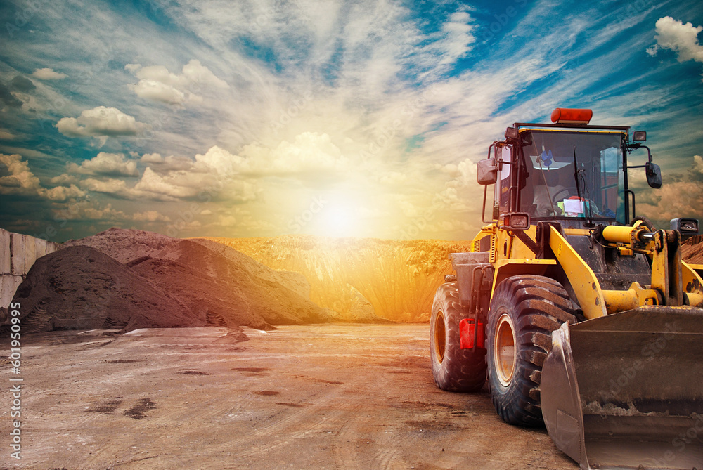 Bulldozer loader machine during earthmoving.Heavy equipment machine wheel loader on construction site .