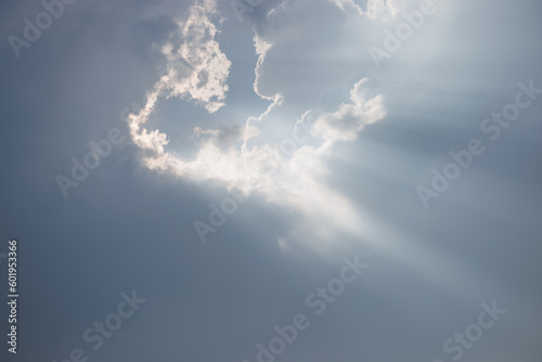 Dramatic Sky and Sun Rays Background. Sunbeams Light and Moody Cloudscape. Sunbeam through the haze in cloudy day.