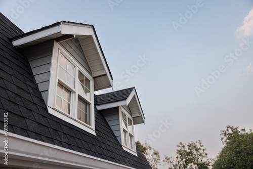 Картината върху платно garret house with roof shingle in the evening time