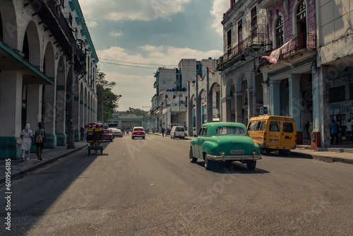 Old American car in the historic streets of Havana in Cuba with old buildings © Nicolas VINCENT