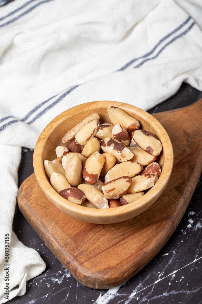 Brazil nut. Brazil nut in wooden bowl. Superfood. Vegetarian food concept. healthy snacks. Close up Brazil nut. Brazil nut in wooden bowl. Superfood. Vegetarian food concept. healthy snacks. Close up