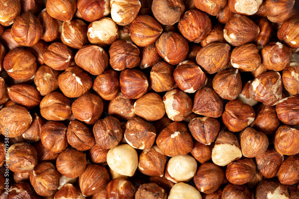 Hazelnut. Peeled hazelnuts closeup food background. Texture. Top view. Copy space banner Hazelnut. Peeled hazelnuts closeup food background. Texture. Top view. Copy space banner