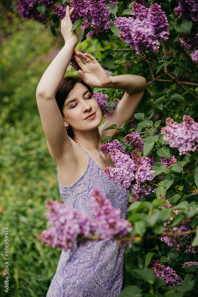 Model natural stylish makeup on a background of flowers Model natural stylish makeup on a background of flowers