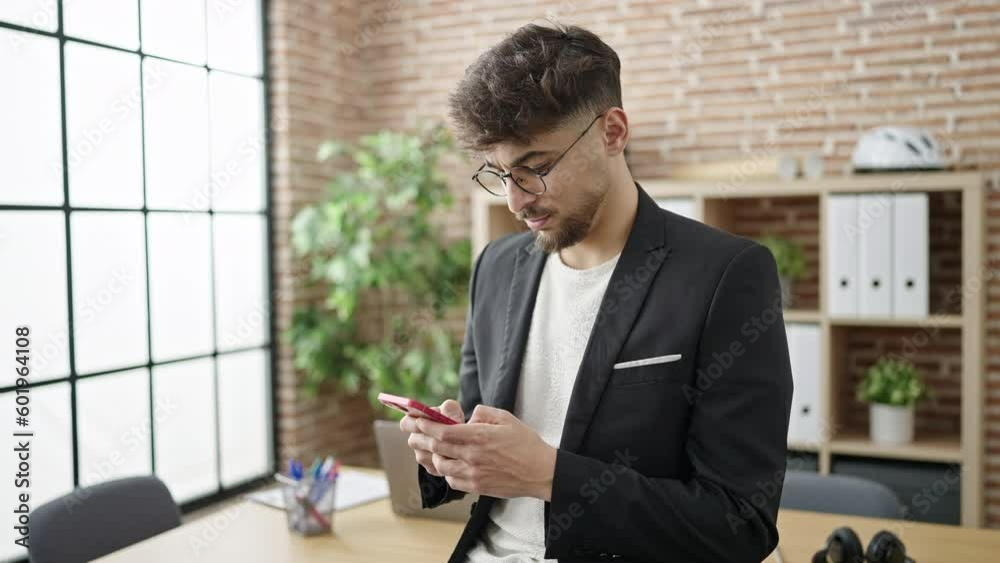 Young arab man business worker using smartphone at office Young arab man business worker using smartphone at office