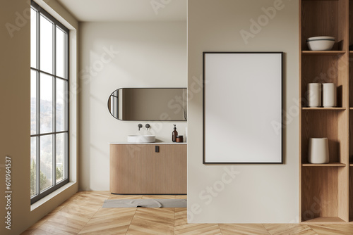 Comfortable beige bathroom with sink and poster