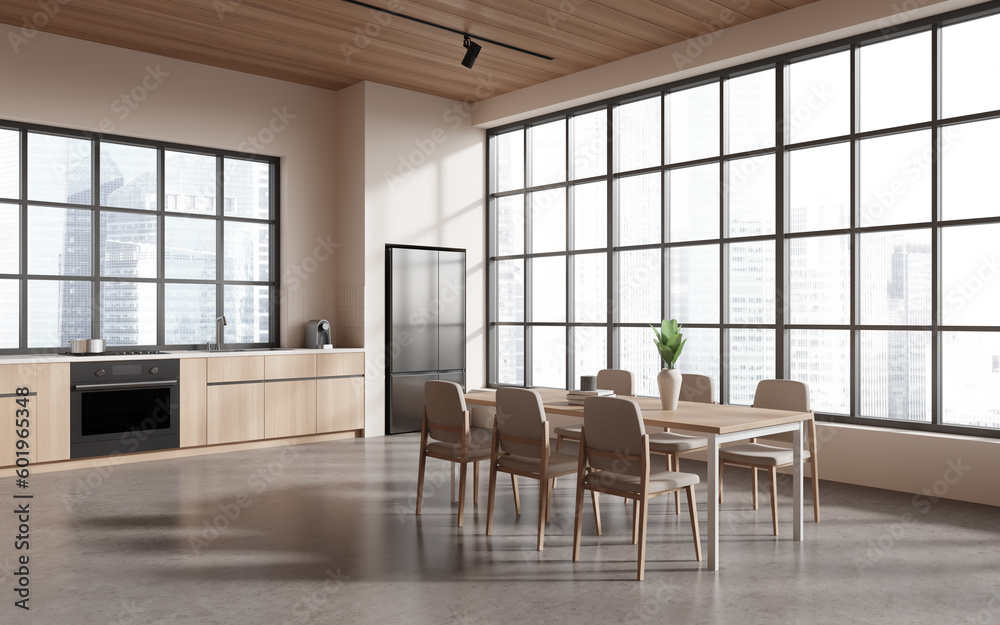 Fototapeta premium Stylish kitchen interior with eating table, kitchenware and panoramic window