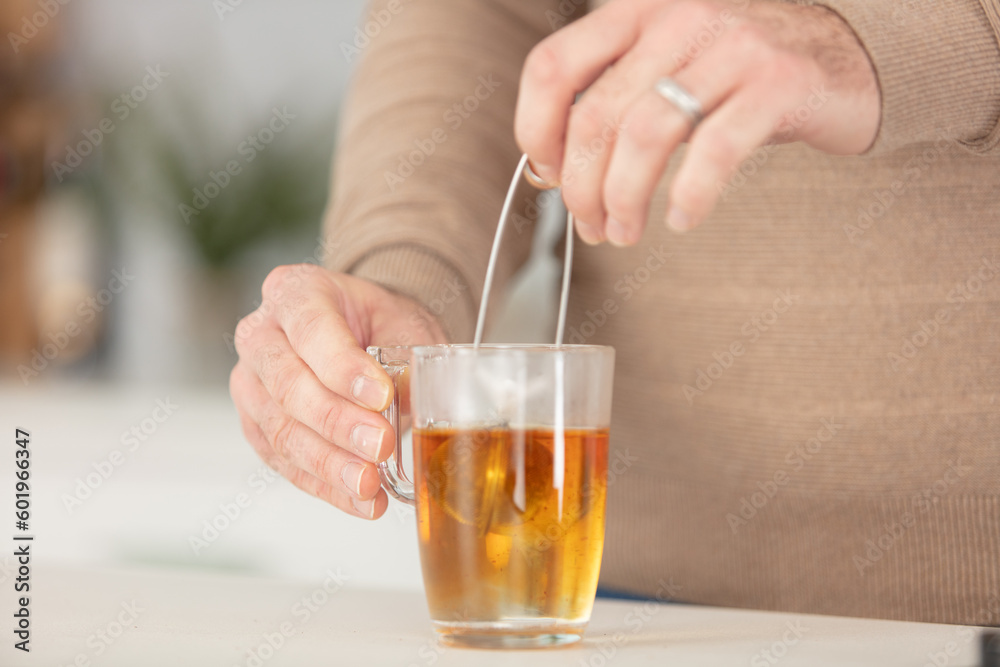 cropped image of teabag in transparent cup cropped image of teabag in transparent cup