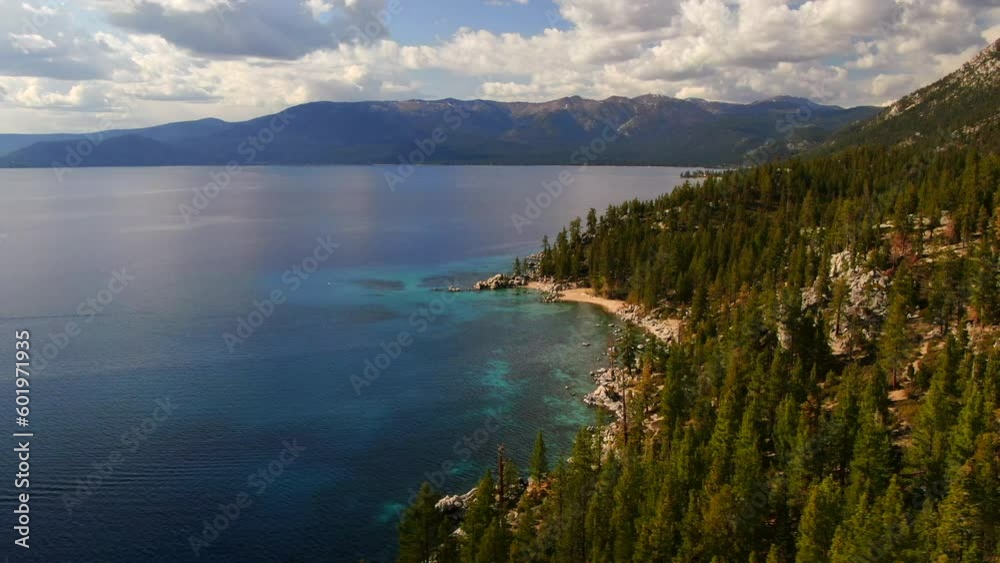 Aerial cinematic drone Lake Tahoe stunning of Chimney Beach polarized aqua blue spring summer beautiful daytime on highway 28 California Nevada border to the right circling movement Aerial cinematic drone Lake Tahoe stunning of Chimney Beach polarized aqua blue spring summer beautiful daytime on highway 28 California Nevada border to the right circling movement