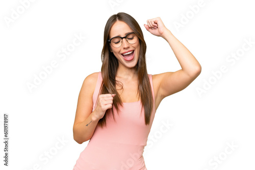 Young pretty caucasian woman over isolated background celebrating a victory