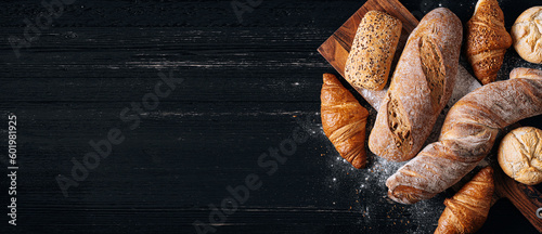 vibrant and appetizing variety of baked goods created by the skilled hands of bakers. Gorgeous bread rolls, perfectly golden croissants, fresh and fragrant baguettes are presented in all their glory.