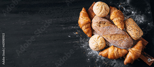 vibrant and appetizing variety of baked goods created by the skilled hands of bakers. Gorgeous bread rolls, perfectly golden croissants, fresh and fragrant baguettes are presented in all their glory.