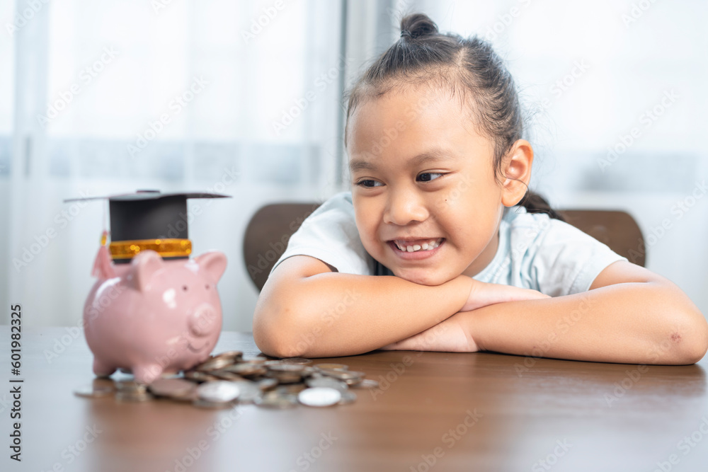 Young girl has saving money coins for education and scholarships Young girl has saving money coins for education and scholarships