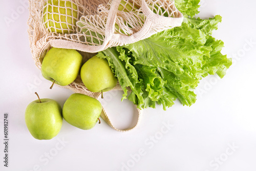 Green food on a white background. Eco-friendly bag. © Anastasia Prisunko