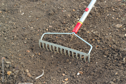 Принти на полотні Closeup of a rake on the soil or earth