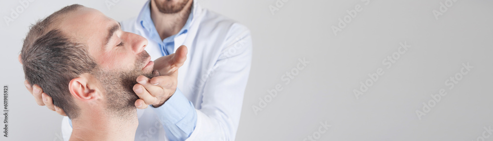 Obraz premium Caucasian doctor massaging patient head.