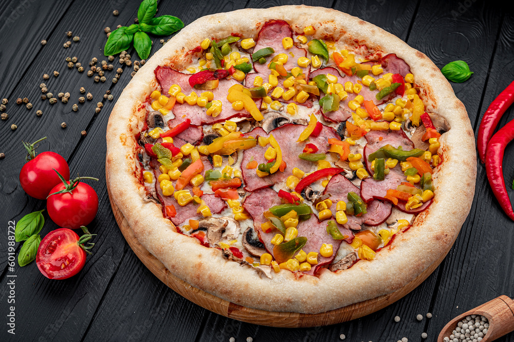 Tasty and big pizza with different types of meat. Pizza with different types of ingredients, sweet paprika and mushrooms