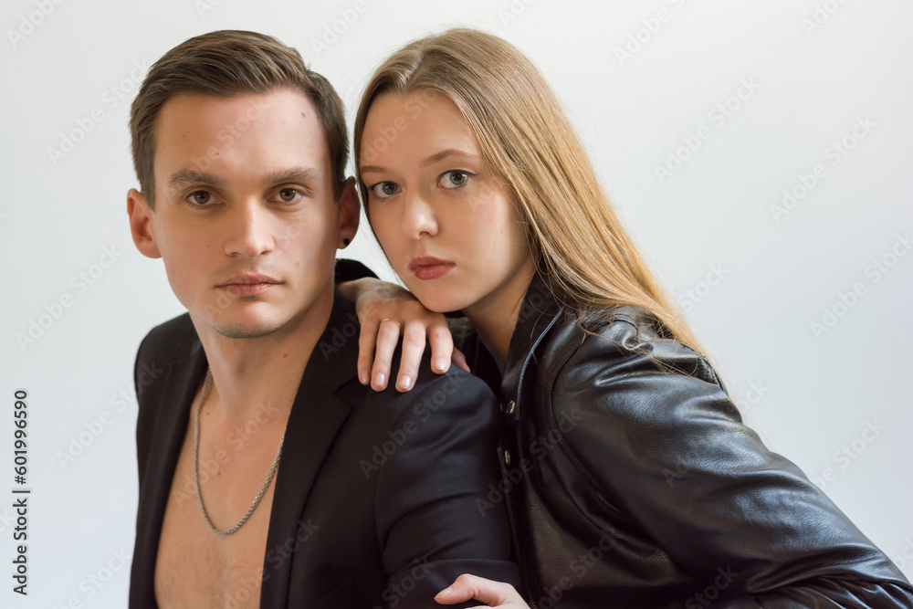 A beautiful young couple - a guy and a girl, fashion models. Couple in love