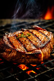 Appetitive spices beef steak sizzling over flaming grill. Gourmet food. Delicious food