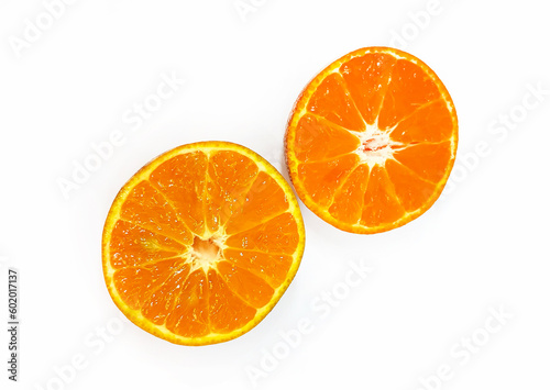 Two half piece slice of fresh orange isolated on white background with clipping path. Freshness fruit. Tropical  Summer and healthy food concept