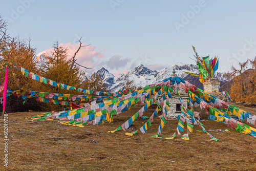 Stupa with prayer flags in Haizi valley near Siguniang mountain in Sichuan province, China