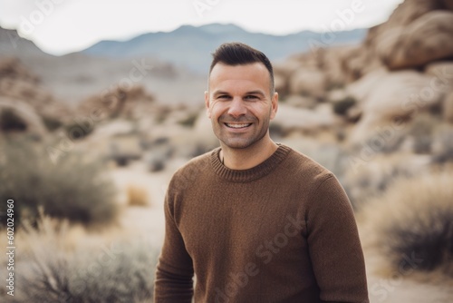 Portrait of a handsome man in the desert of Joshua Tree National Park