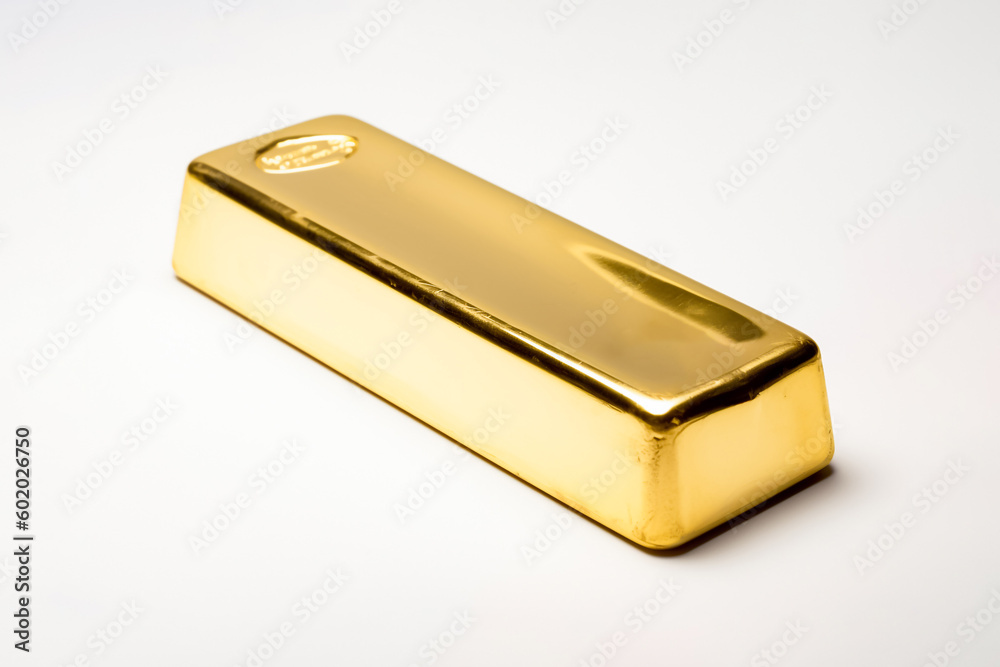 An unadorned gold bar sits on a plain white backdrop in studio lighting, free from any text or markings. generative AI. An unadorned gold bar sits on a plain white backdrop in studio lighting, free from any text or markings. generative AI.
