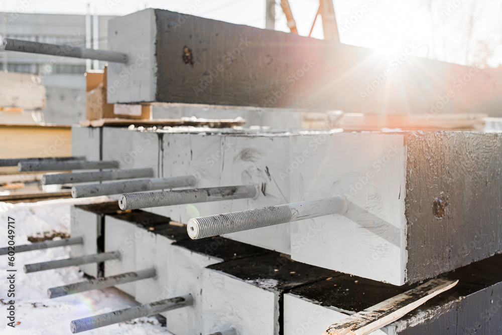 Close-up plan of a metal embedded part of a reinforced concrete pile for the construction of foundations for high-voltage power lines.