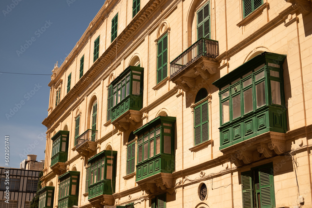 Old colored windows and a balcony in the old town. Malta
