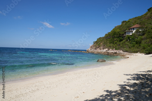 sea beach in thailand shore trees house and sand