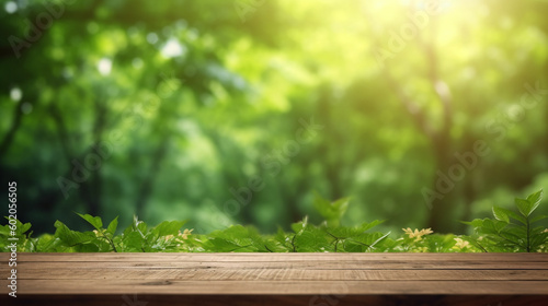 A wooden table with a green leafy background