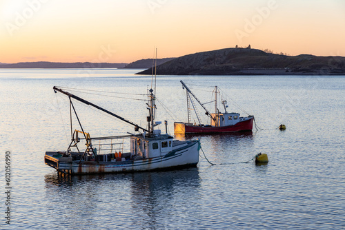 fishing boats at sunset photo