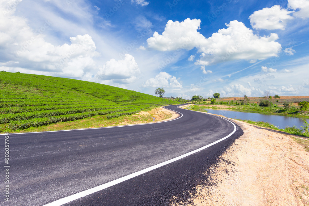 The Choui Fong tea plantation and road with blue sky at Mae jan , tourist attraction at Chiang Rai province in thailand