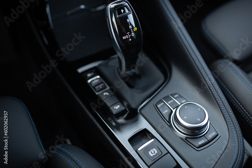 Modern and expensive car multimedia control panel, with a gearbox and start function 