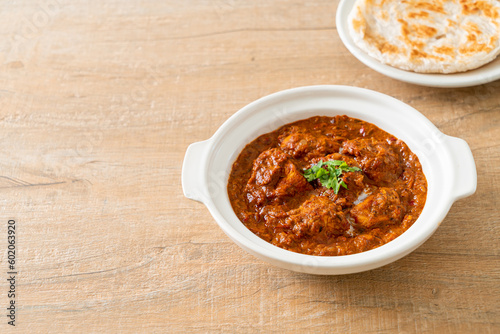 chicken tikka masala spicy curry meat food with roti or naan bread