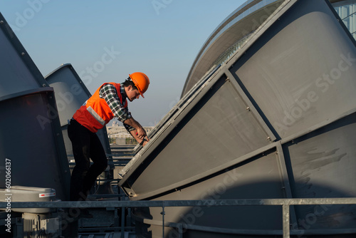 Wallpaper Mural Engineer under checking the industry cooling tower air conditioner is water cooling tower air chiller HVAC of large industrial building to control air system. Torontodigital.ca