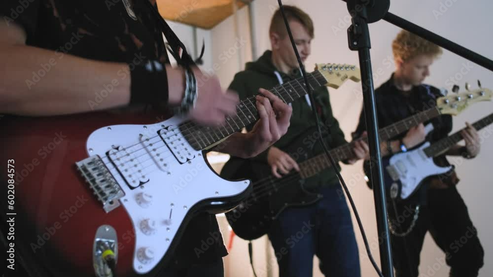 rehearsal of guitarists from a rock band