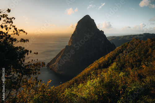 Pitons on Santa Lucia, La Souffriere bay during sunset with blue sky and cotton candy clouds. Caribbean Island. Vieux Fort, Saint Lucia. Travel and honeymoon concept.