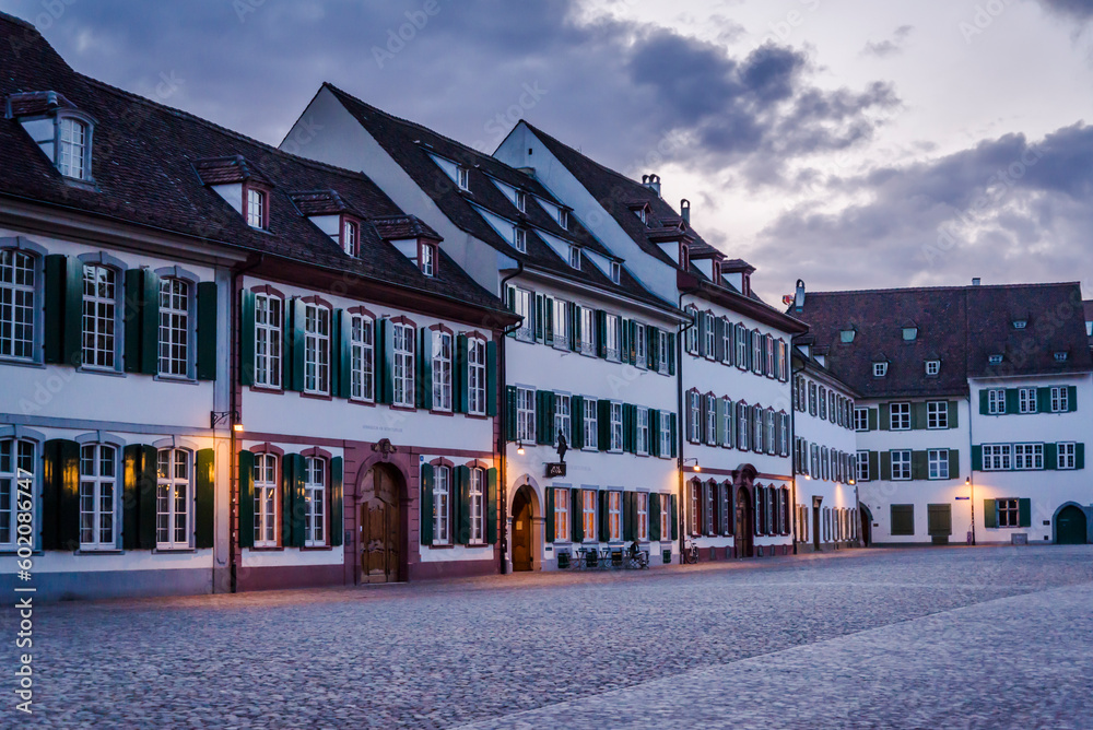 Minster Cathedral Square with old-world architecture at dusk, Basel, Switzerland