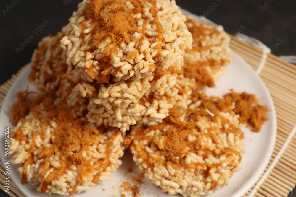 Khaotan - Rice Crispy, a traditional Thai dessert sprinkled with sugar. (spot focus) Khaotan - Rice Crispy, a traditional Thai dessert sprinkled with sugar. (spot focus)