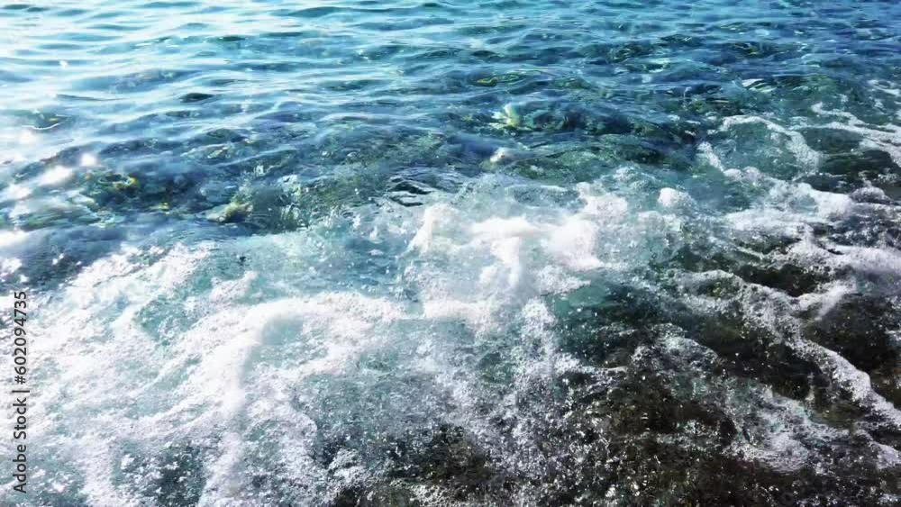 View of the sea waves at the beach, Paros Island. Aegean Sea, Cyclades Archipelago, Greece. View of the sea waves at the beach, Paros Island. Aegean Sea, Cyclades Archipelago, Greece.