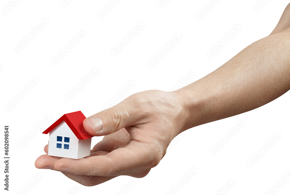 Hand holding a small red roofed house, cut out Hand holding a small red roofed house, cut out