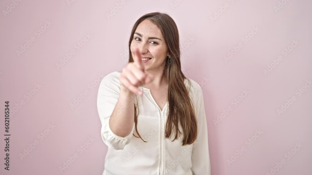Young beautiful hispanic woman smiling confident doing telephone gesture with hand over isolated pink background Young beautiful hispanic woman smiling confident doing telephone gesture with hand over isolated pink background