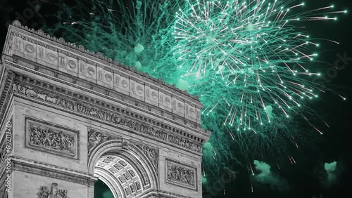 Celebratory fireworks over the Arc de Triomphe ( 4K, time lapse, with zoom), Paris, France. The walls of the arch are engraved with the names of 128 battles and names of 660 French military leaders  photo