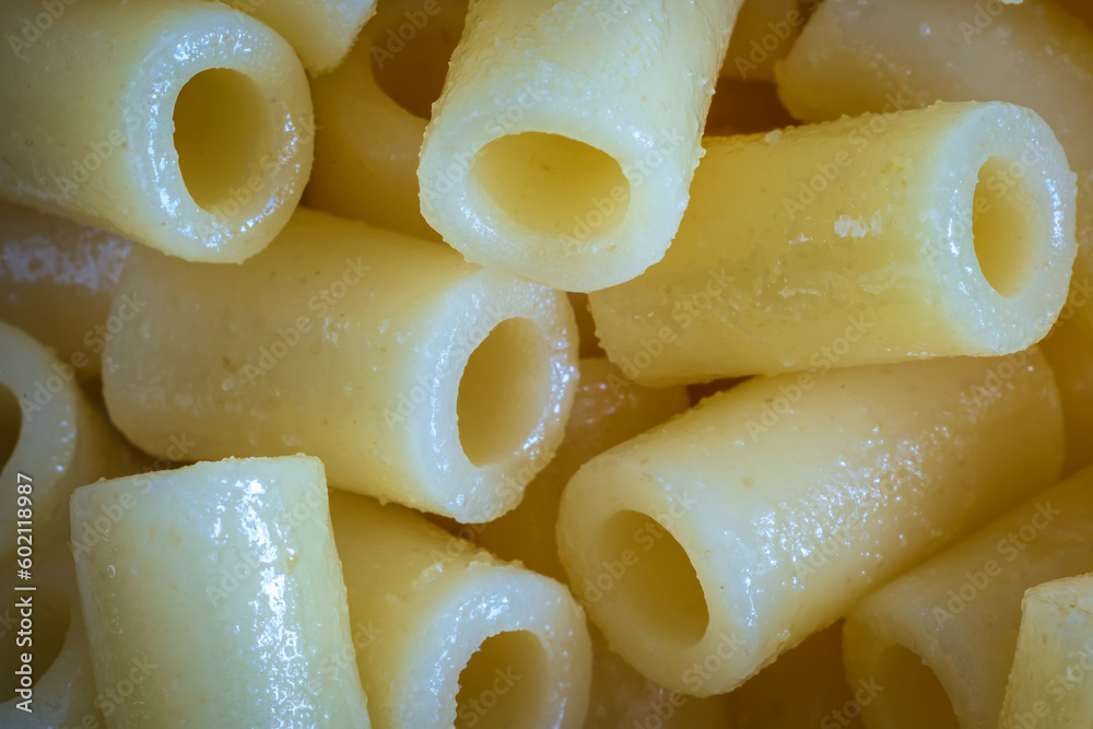 Cooked rigatoni pasta background closeup