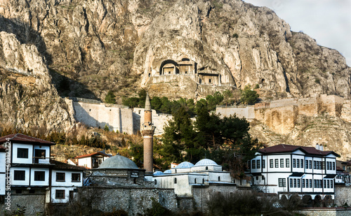 beautiful view  of old Ottoman houses in the city of Amasya, Turkey. Historic,ancient facades on the river.  Landscape with caves with tombs carved into the mountain.
