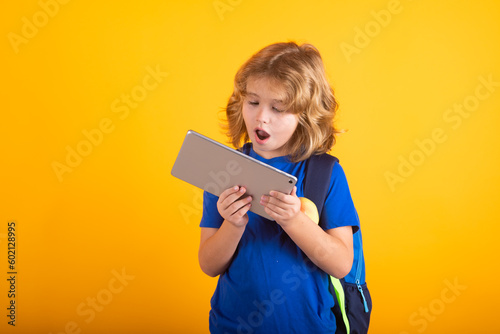 Excited pupil. Little student school child isolated on studio background. Portrait of nerd student with school supplies.