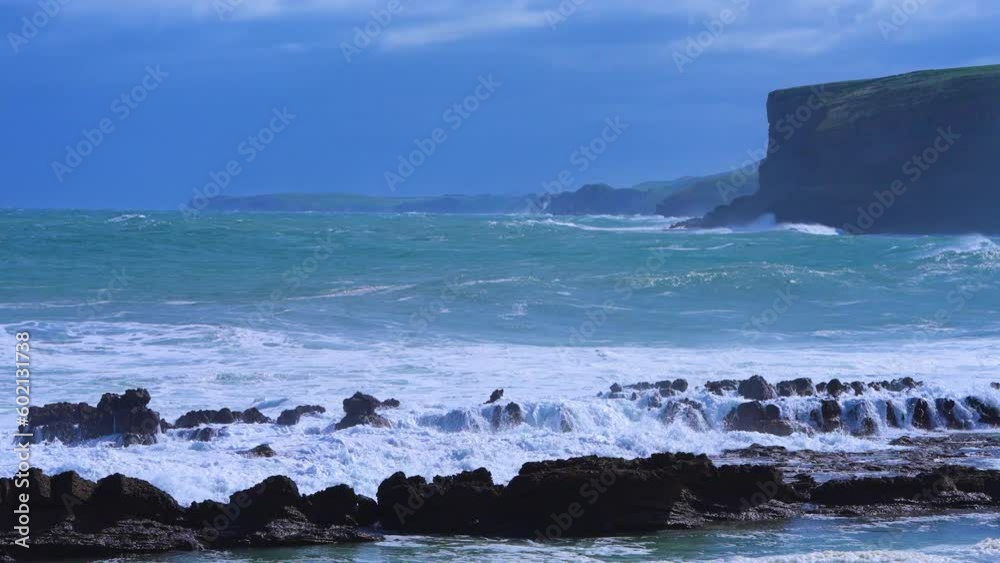 Stormy day and waves in La Canalona near Luaña beach in Cóbreces. Municipality of Alfoz de Loredo. Cantabrian Sea, Cantabria, Spain, Europe Stormy day and waves in La Canalona near Luaña beach in Cóbreces. Municipality of Alfoz de Loredo. Cantabrian Sea, Cantabria, Spain, Europe