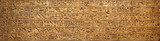 Old Egyptian hieroglyphs on an ancient background. Wide historical background. Ancient Egyptian hieroglyphs as a symbol of the history of the Earth.