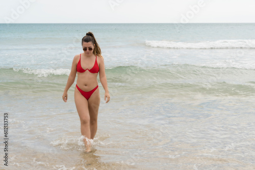 Young beautiful woman on the beach 