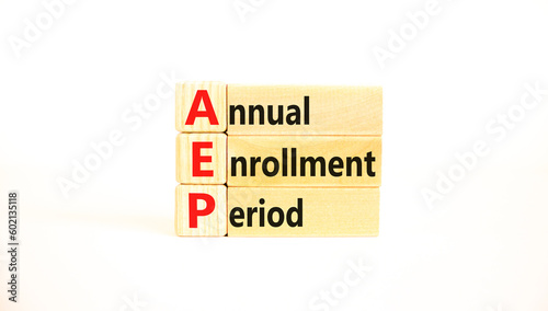 AEP symbol. Concept words AEP Annual enrollment period on beautiful wooden block. Beautiful white table white background. Medical and AEP Annual enrollment period concept. Copy space.